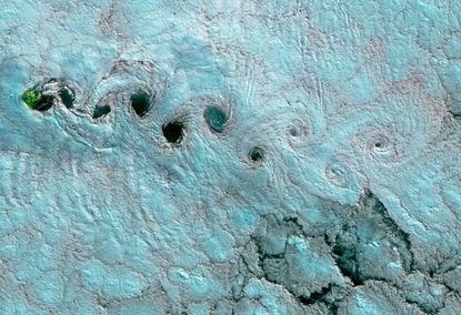 This false-color image, captured on June 25, 2017, by an instrument aboard the Landsat-8 satellite, shows a cloud phenomenon called von K&aacute;rm&aacute;n vortices above the South Atlantic.