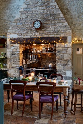 Christmas kitchen with fireplace and dining area