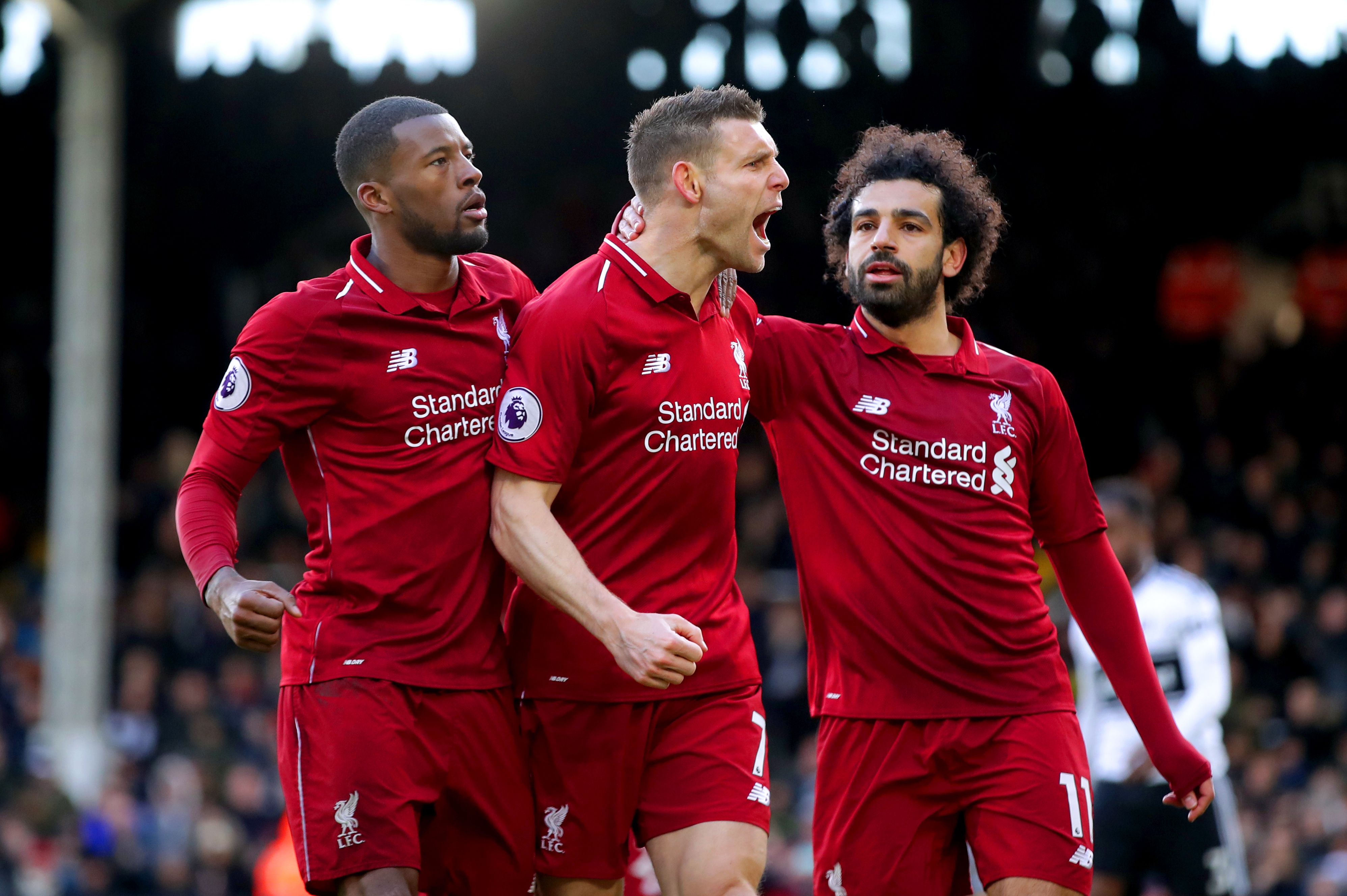 James Milner, centre, celebrates his winner against Fulham