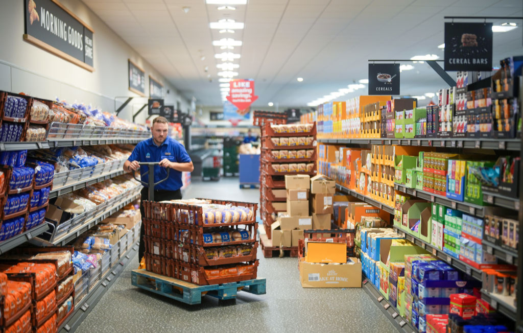 Supermarket shelves being stacked