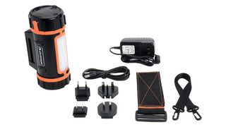 Celestron PowerTank on a white background with accessories laid out