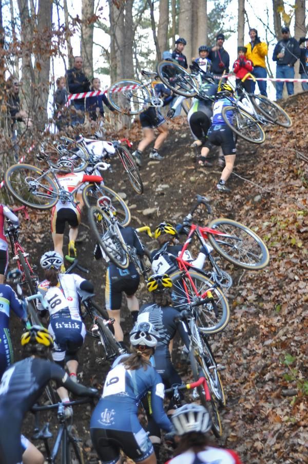 Elite Women scramble up the loose run-up just after the holeshot.