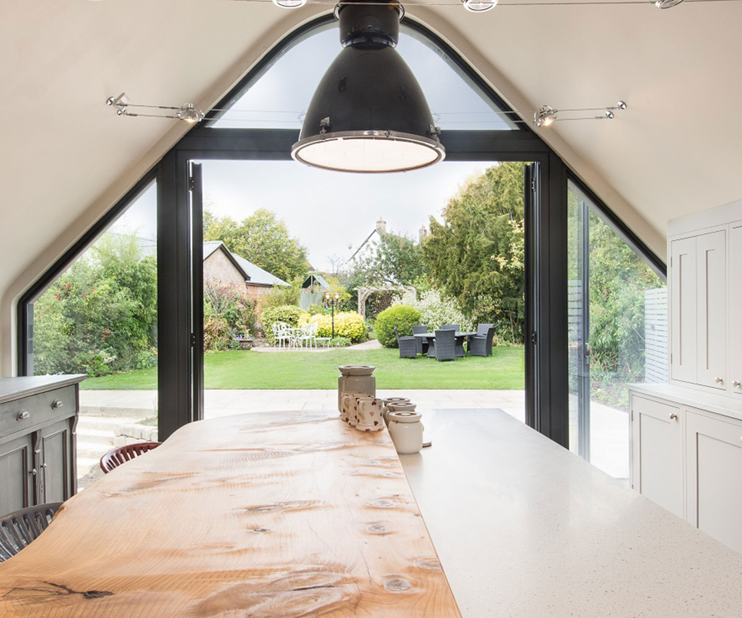 modern aluminium French doors within triangular opening