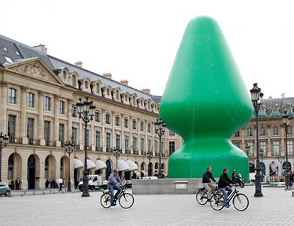 American artist slapped in the face after erecting giant sex-toy sculpture in the middle of Paris