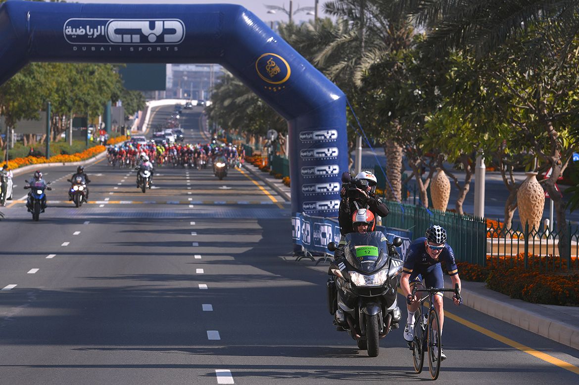 The peloton has sight of Andy Fenn with 10 kilometres to go