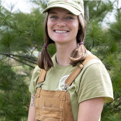 Marts Lynch standing in front of a tree