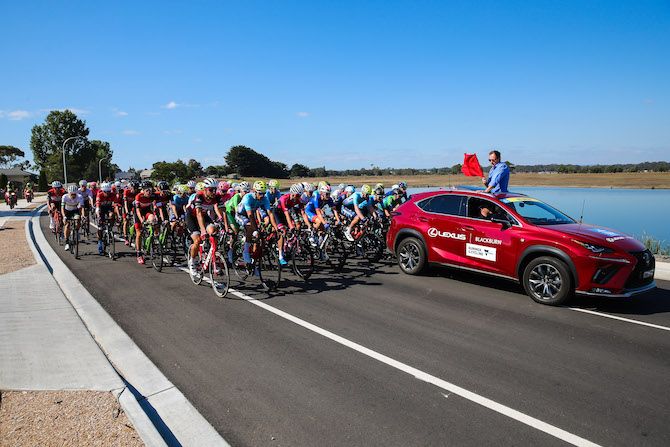 Under start's orders: race director Scott McGrory readies himself to drop the flag at the 2019 Jayco Herald Sun Tour