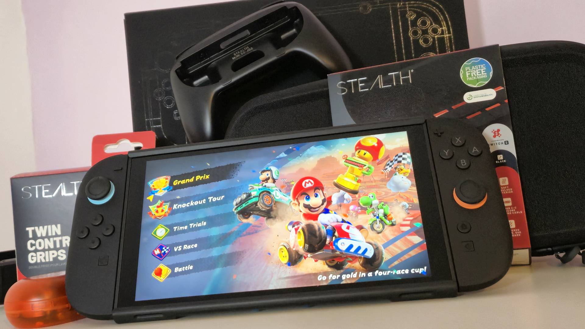 Photo by Rosalie Newcombe of the Nintendo Switch 2 sitting with a pile of accessories.