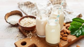 Alternative types of vegan milks in glass bottles