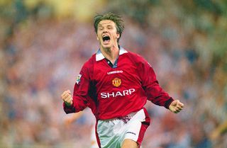 David Beckham of Manchester United celebrates after scoring the third goal in the 1996 FA Charity Shield between Manchester United and Newcastle United at Wembley Stadium on August 11, 1996 in London, England.