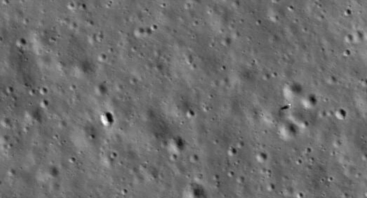 Chang'e 4 lander (right) and Yutu 2 rover (left) and its faint tracks roving tracks, imaged by NASA's LRO orbiter in January 2020.