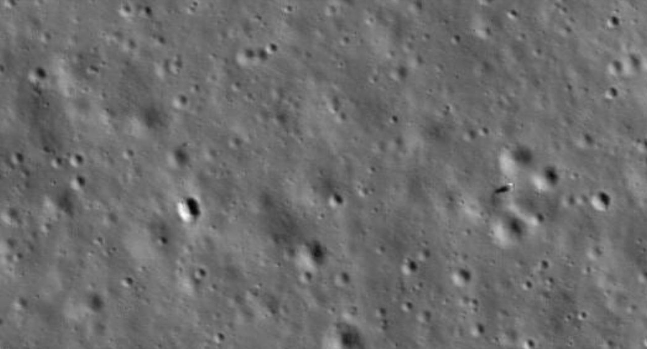 Chang'e 4 lander (right) and Yutu 2 rover (left) and its faint tracks roving tracks, imaged by NASA's LRO orbiter in January 2020.