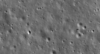 Chang'e 4 lander (right) and Yutu 2 rover (left) and its faint tracks roving tracks, imaged by NASA's LRO orbiter in January 2020.