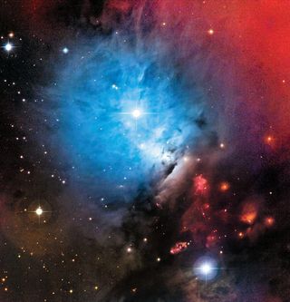 Interstellar molecular clouds shine with light from nearby luminous stars, creating reflection nebula NCG 1333. Carbon and silicon atoms in the cloud's molecules scatter blue light more efficiently than red light, producing the distinctive color.