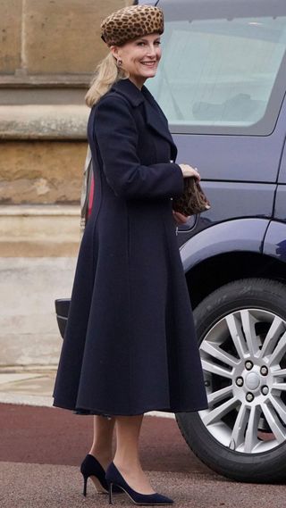 Duchess Sophie, wearing a navy coat and leopard print accessories, arrives to attend the Christmas Day church service at St George's Chapel 2021