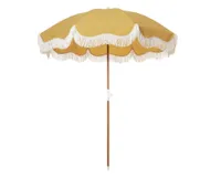 A yellow garden parasol with white fringing