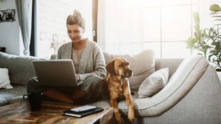 Woman looking at laptop, working from home