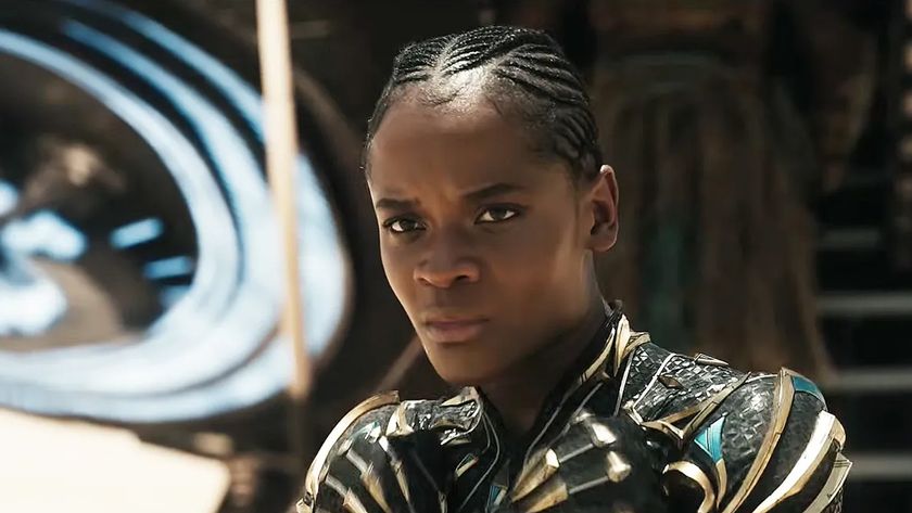 A woman stands in a desert