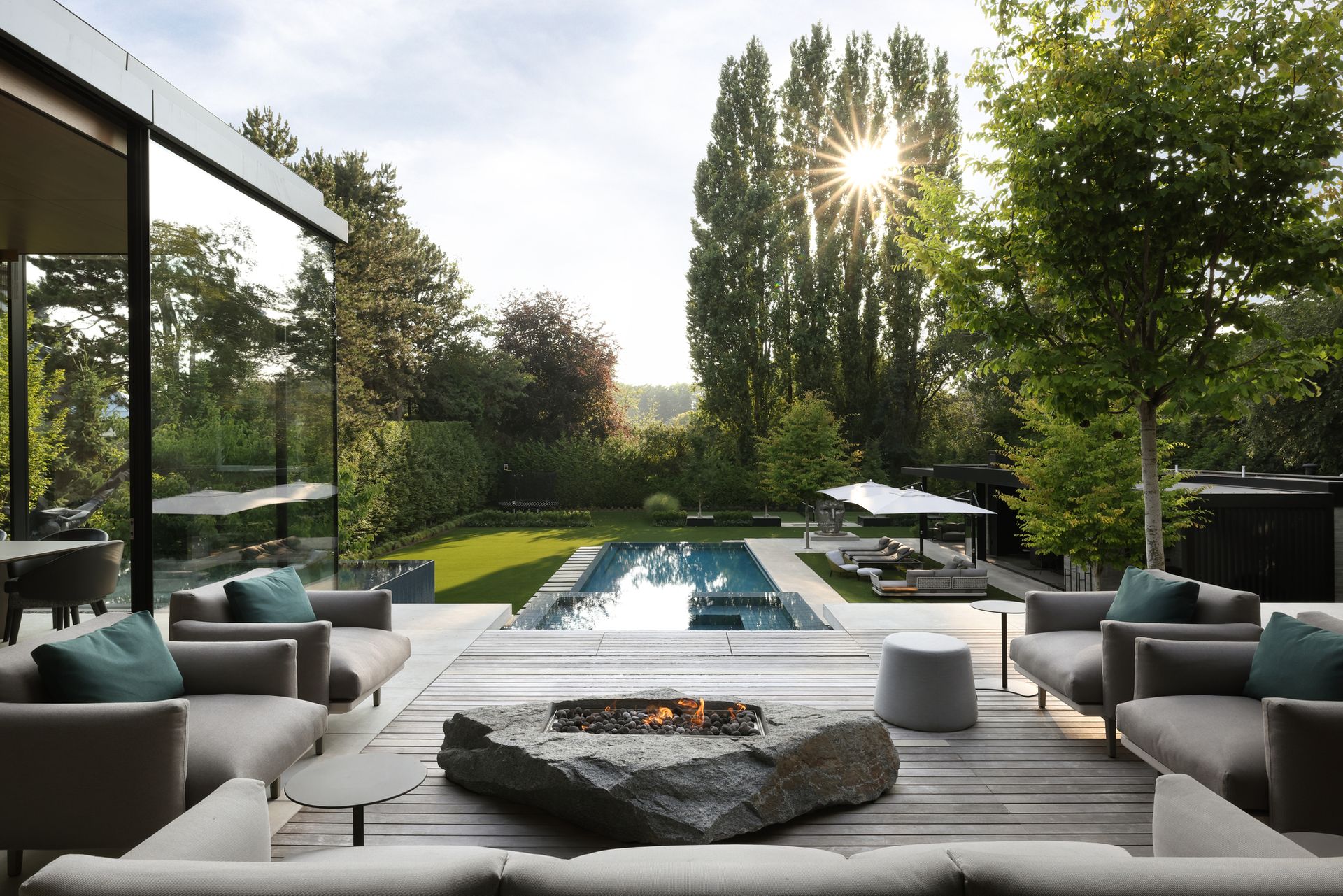 An outdoor living area overlooking the pool