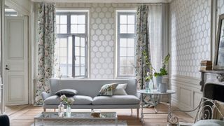 Designers Guild Zardozi wallpaper in Oyster; curtains in Adachi Celadon; Palermo sofa; Katiya Platinum rug