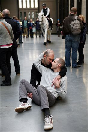Two men hugging on the floor