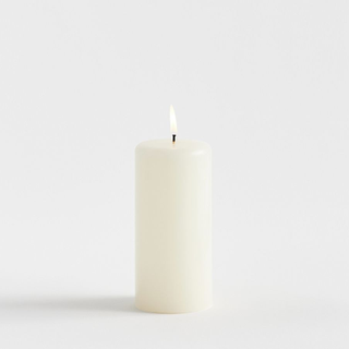 cream-colored pillar candle