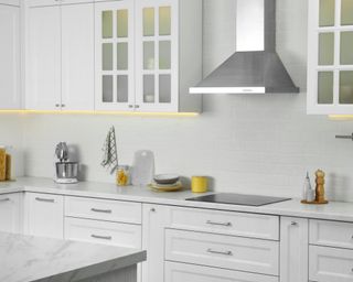 White kitchen with silver hood