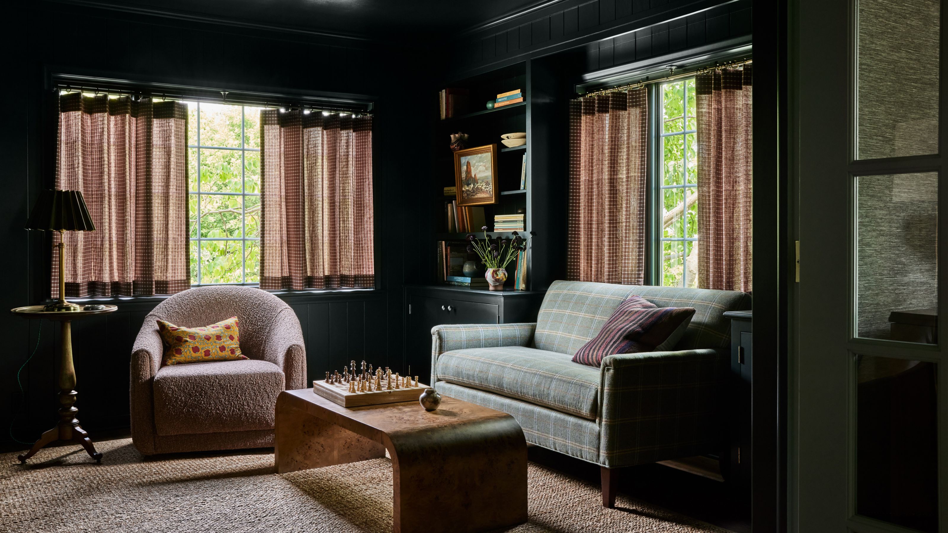 dark green small living room painted in Black Forest Green by Benjamin Moore
