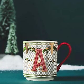 Bistro Festive Tile Stoneware Monogram Mug against a blue background.