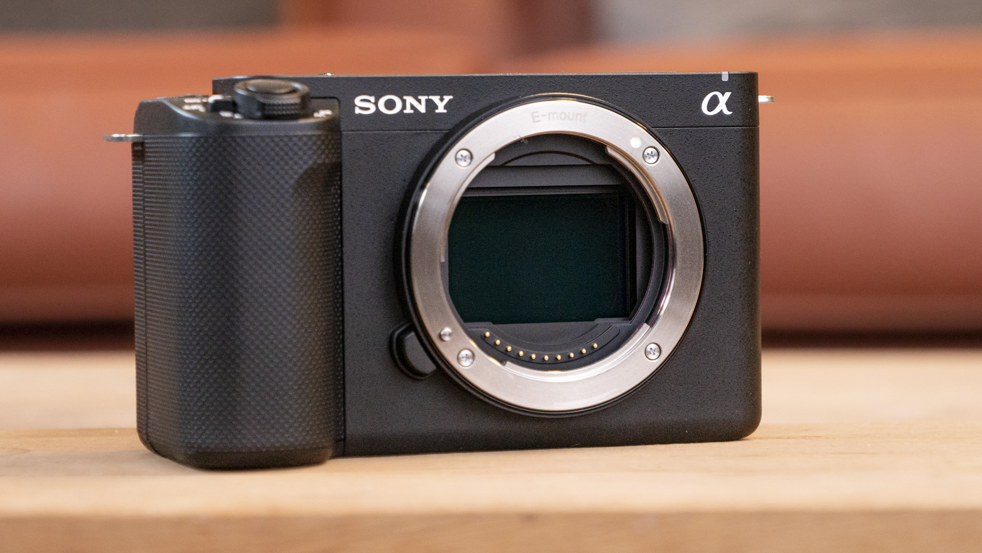 The Sony ZV-E1 camera sitting on a wooden table