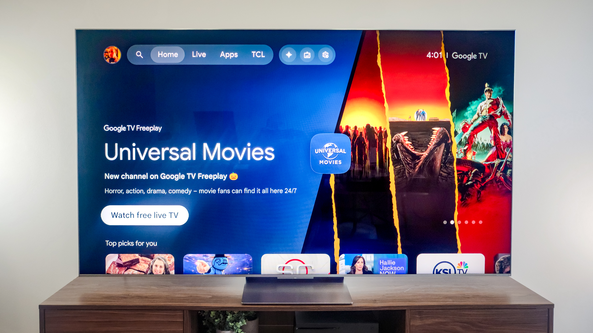 A TCL QM9K TV on a side table