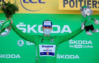 Team Deceuninck rider Irelands Sam Bennett celebrates his best sprinters green jersey at the end of the 11th stage of the 107th edition of the Tour de France cycling race 167 km between Chatelaillon Plage and Poitiers on September 9 2020 Photo by Christophe Petit Tesson POOL AFP Photo by CHRISTOPHE PETIT TESSONPOOLAFP via Getty Images