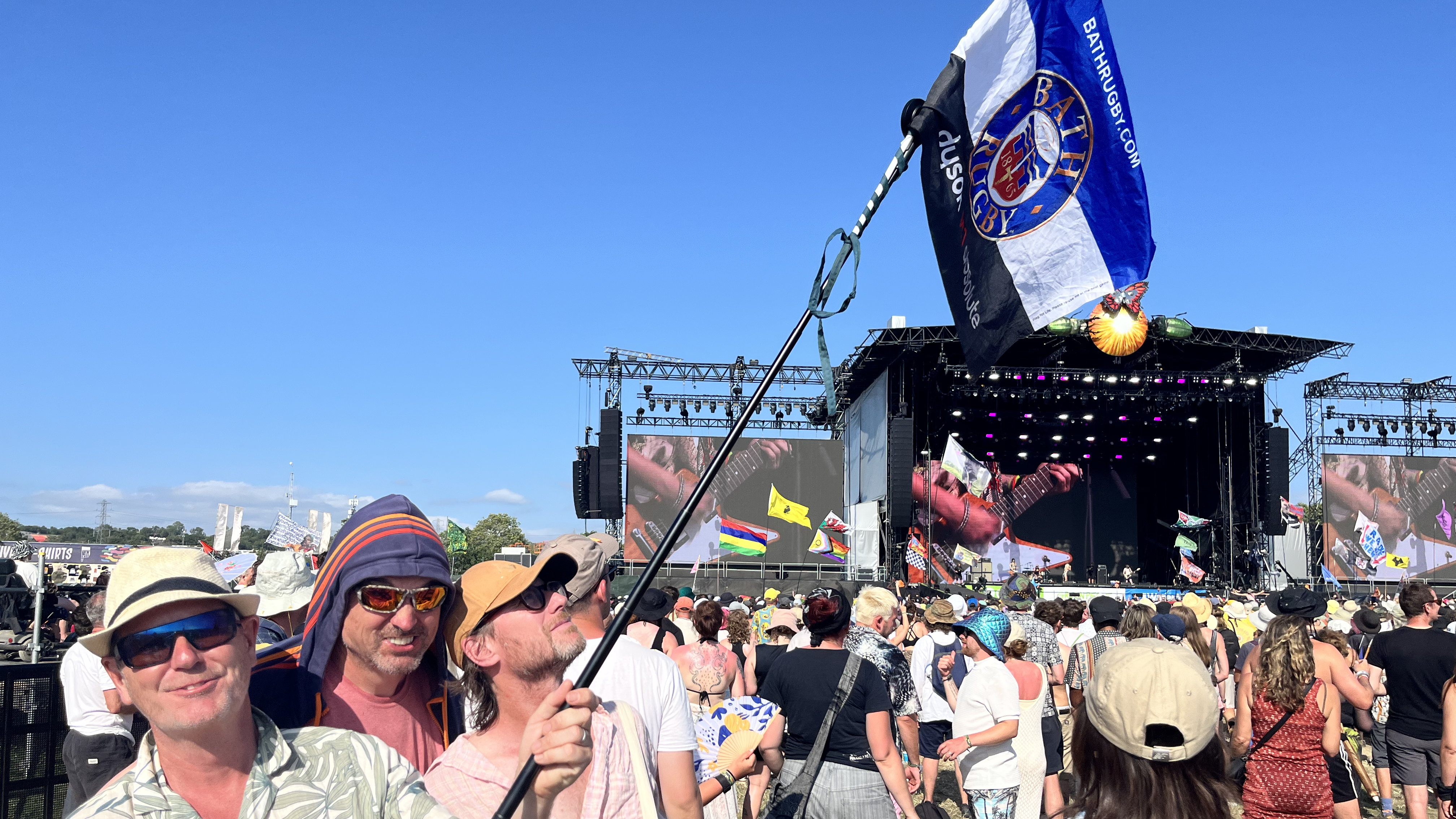 KraftGeek JustTap Magnetic Phone Tripod being used as a flagpole at Glastonbury festival 2025