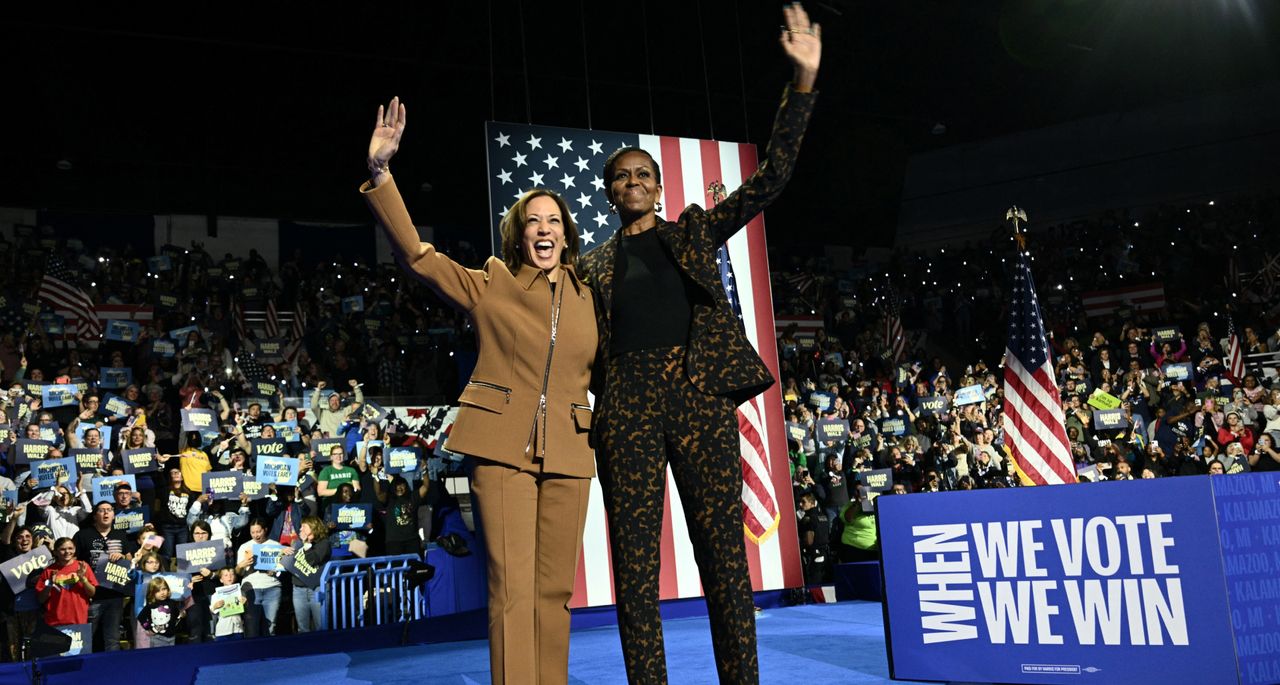 Michelle Obama and Kamala Harris hug onstage at a rally for the 2024 election