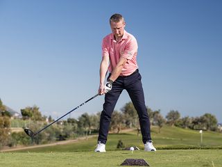 Anders Mankert demonstrating the initial low, wide takeaway in the backswing with driver