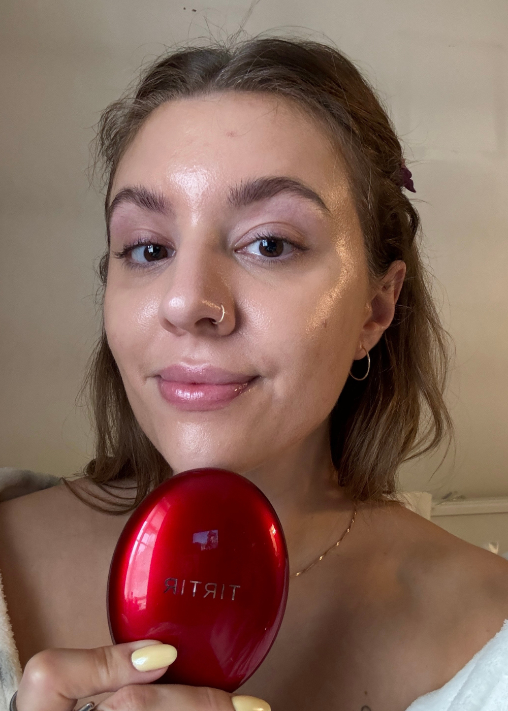 Beauty editor Rebecca holding the TirTir Foundation