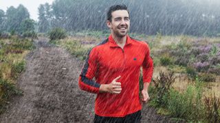 Happy man running in the rain