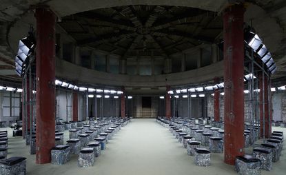 Hall for fashion show with chairs and open space.