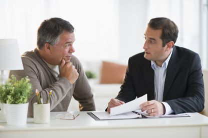 Financial advisor talking with client