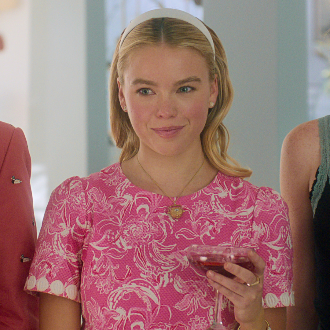 a close up of Milly Alcock wearing a nantucket basket necklace