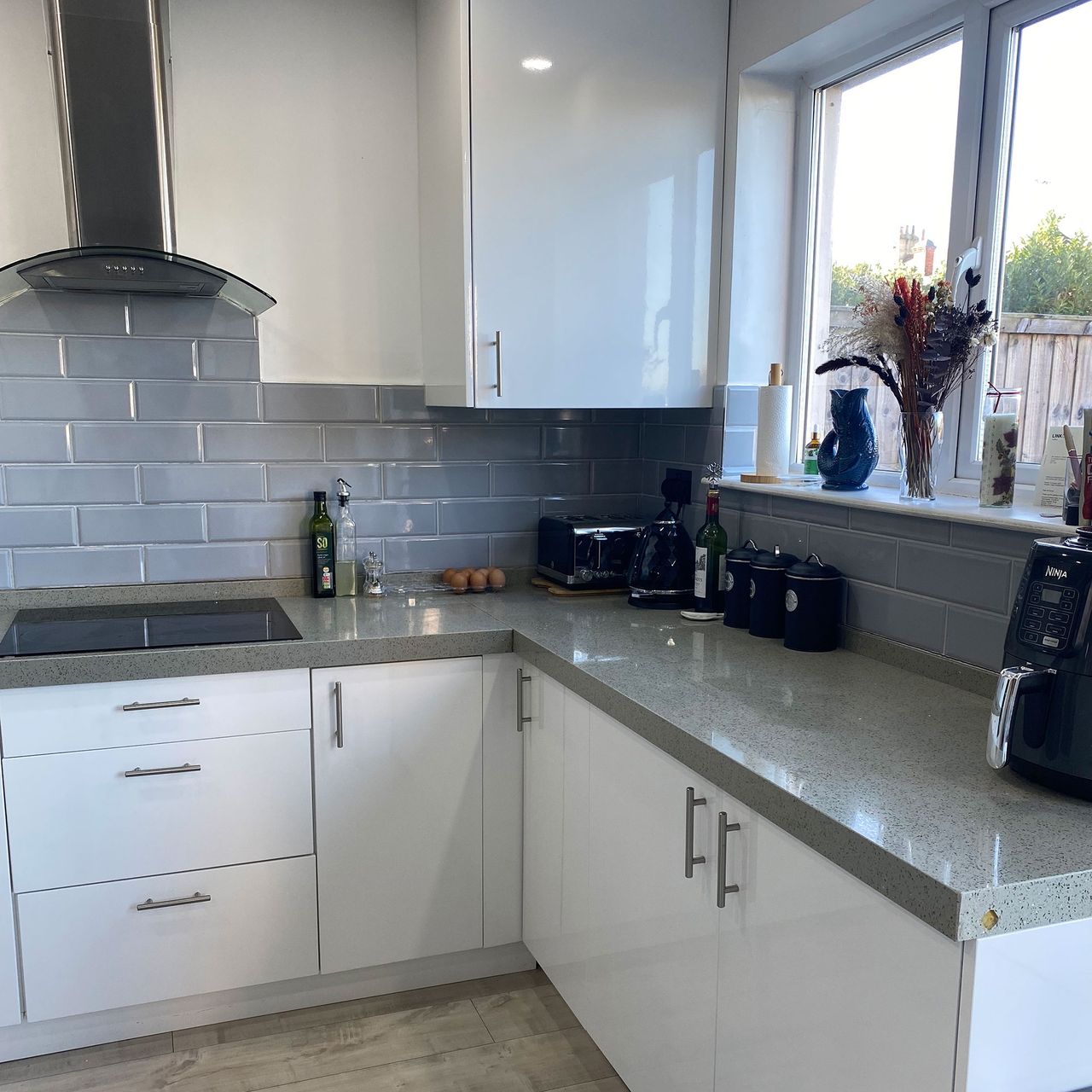 Corner of white and grey kitchen