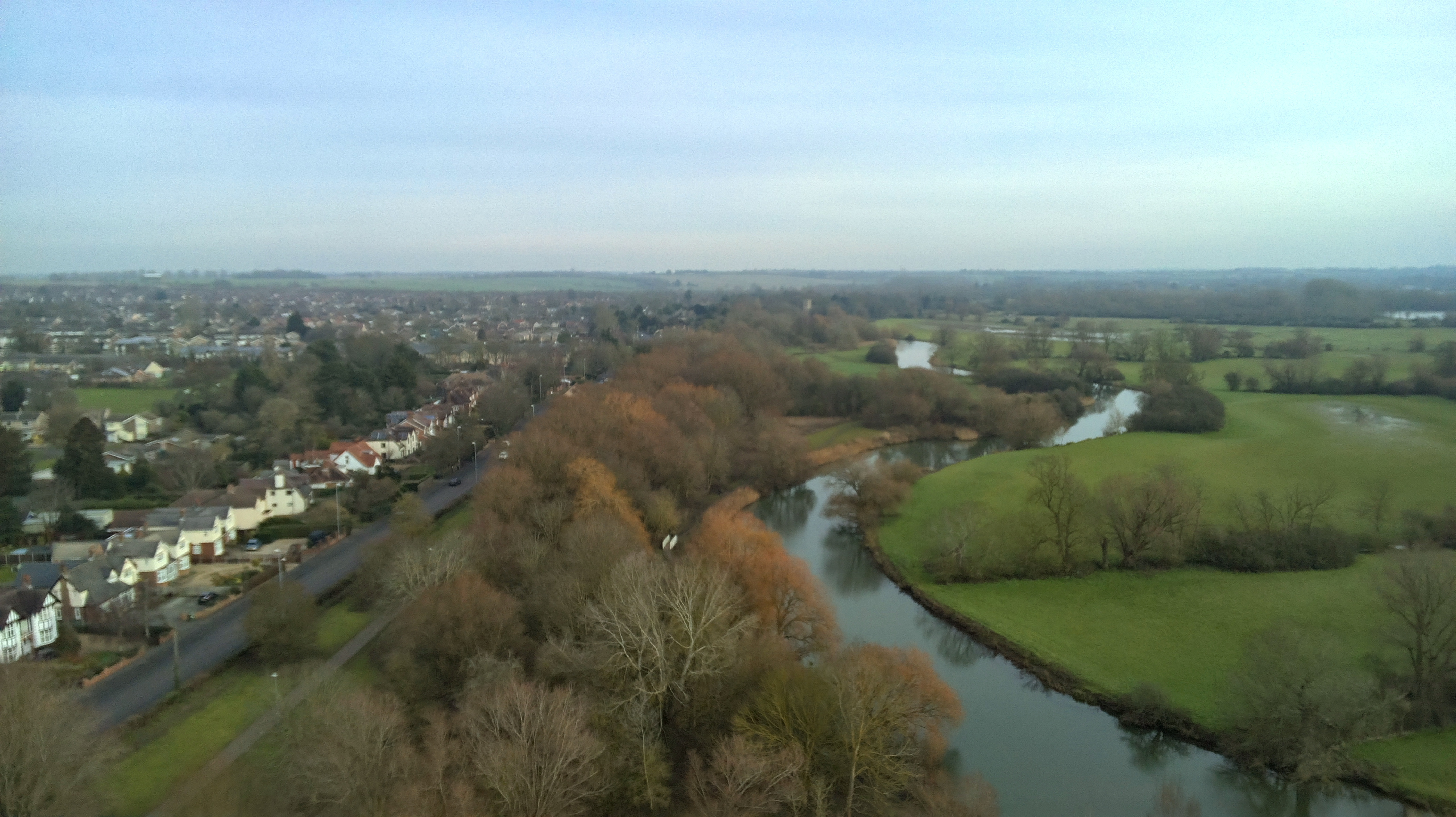 Photo of a river at the edge of a town taken with the Ruko F11PRO 2 drone