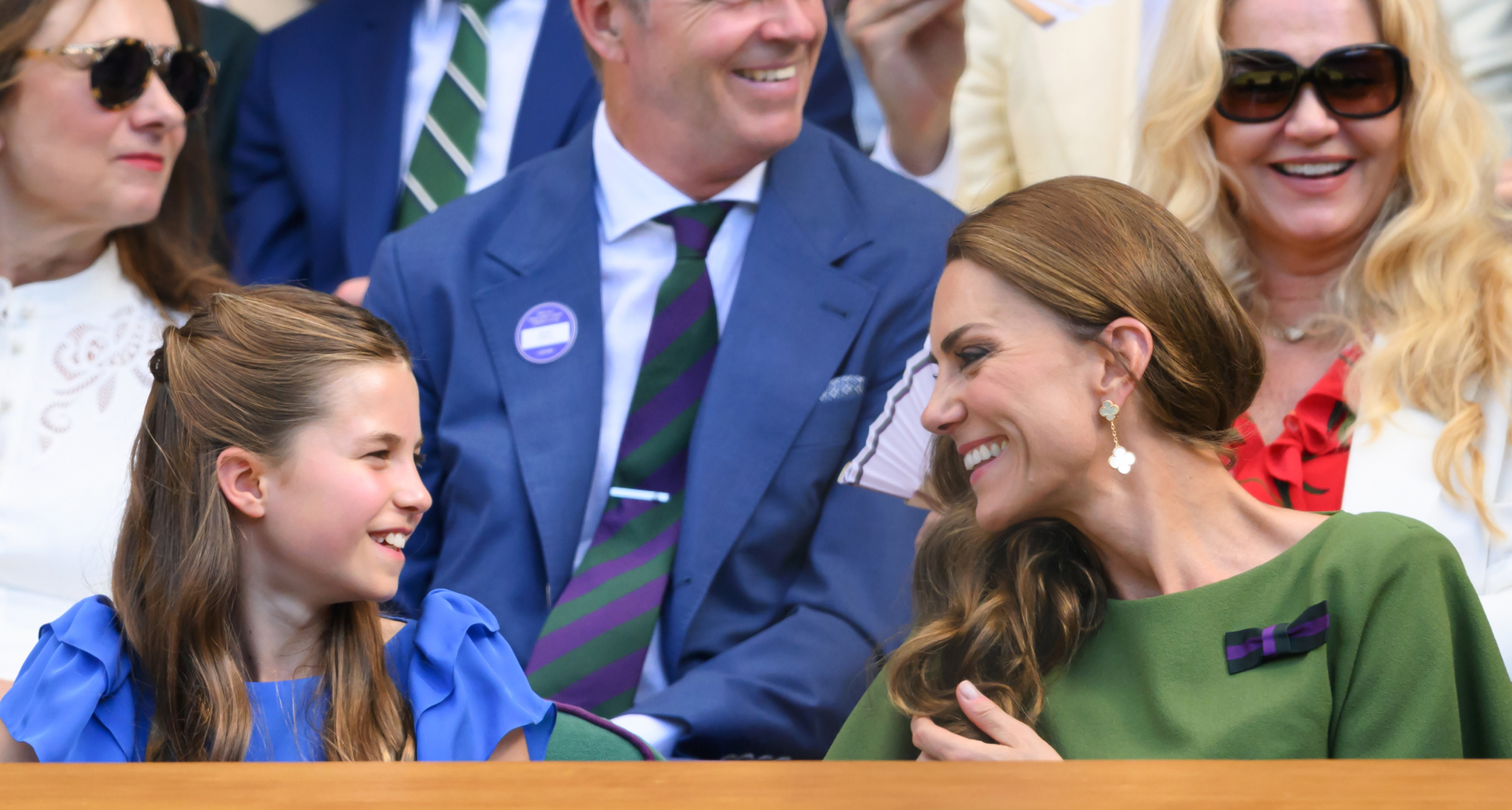 Princess Charlotte smiling at Princess Kate at Wimbledon