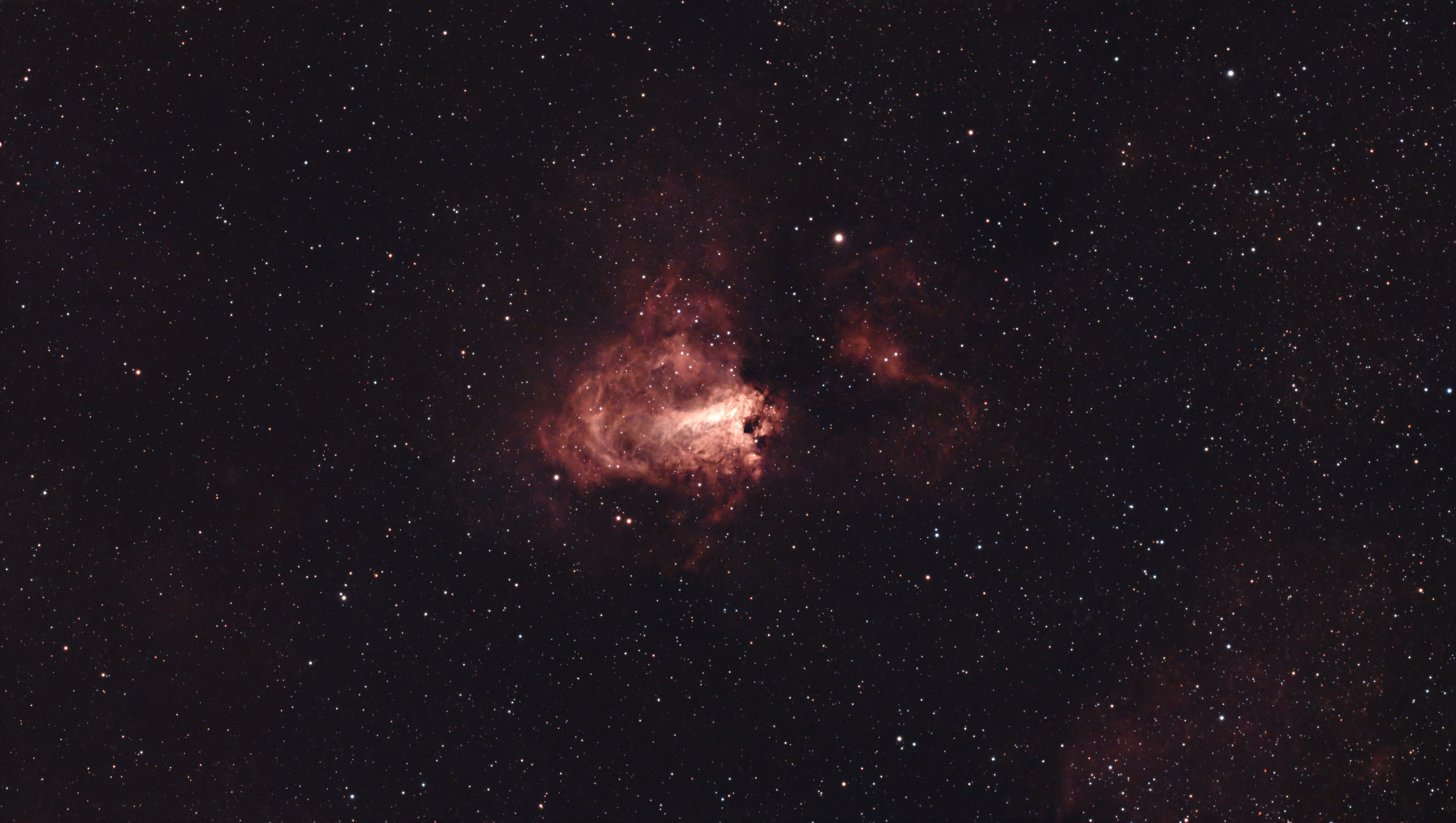 A photograph of the Omega Nebula, taken with the Dwarf III smart telescope, processed in Pixinsight