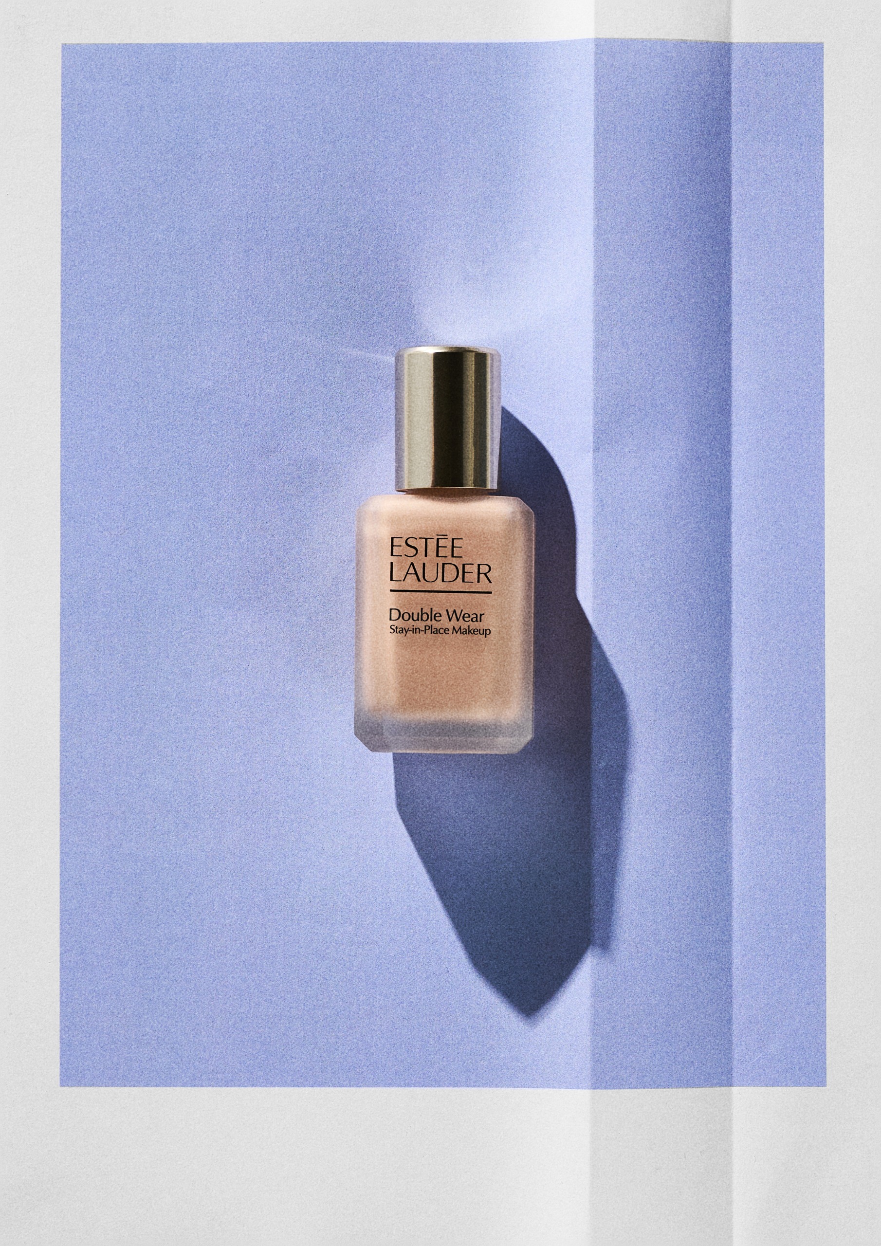 Este&eacute; Lauder Double Wear Stay-in-Place Foundation on a blue background
