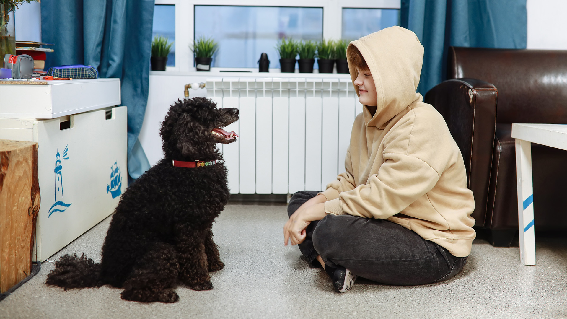 Child and poodle in therapy session