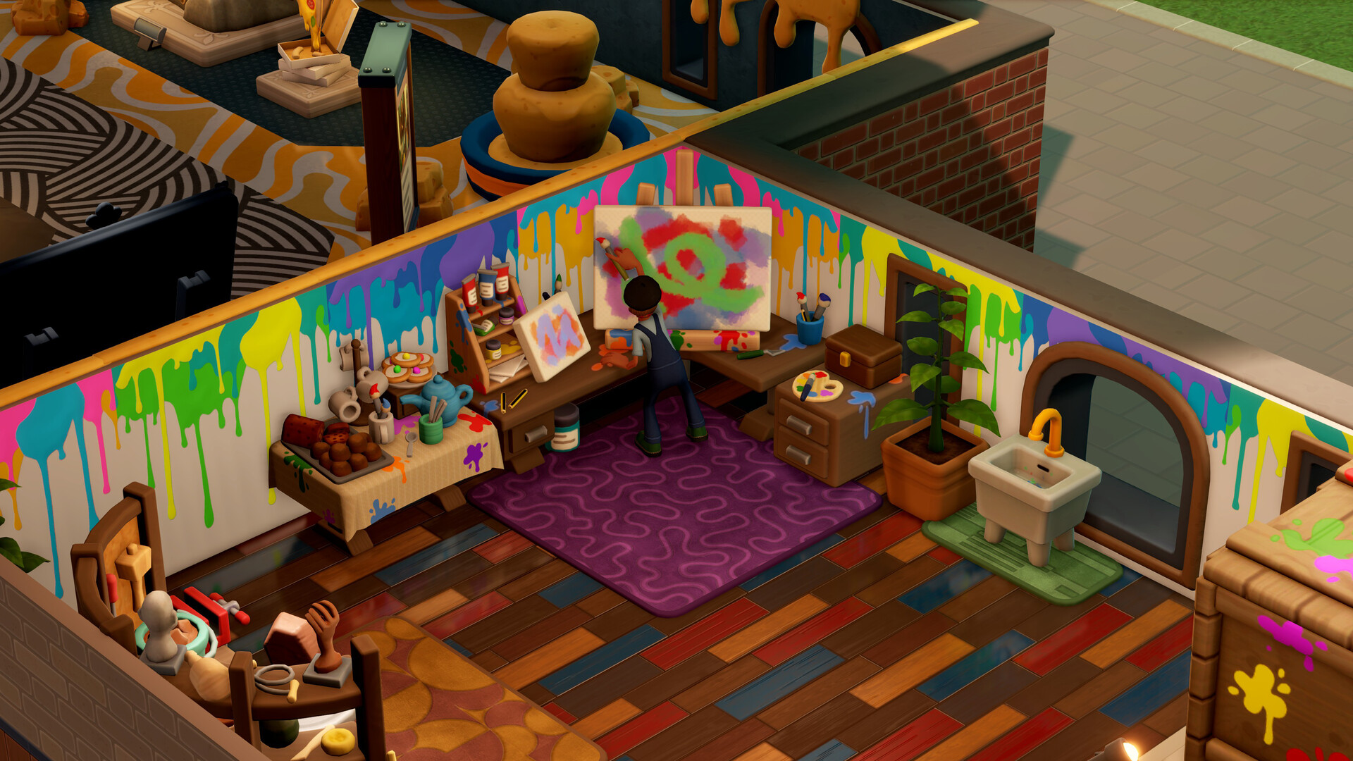 An artist paints on a canvas in a paint-dappled studio in Two Point Museum