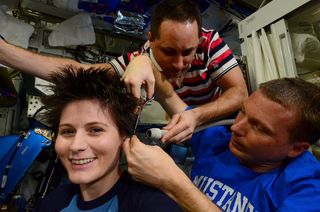 Expedition 42 Samantha Cristoforetti Getting Hair Cut