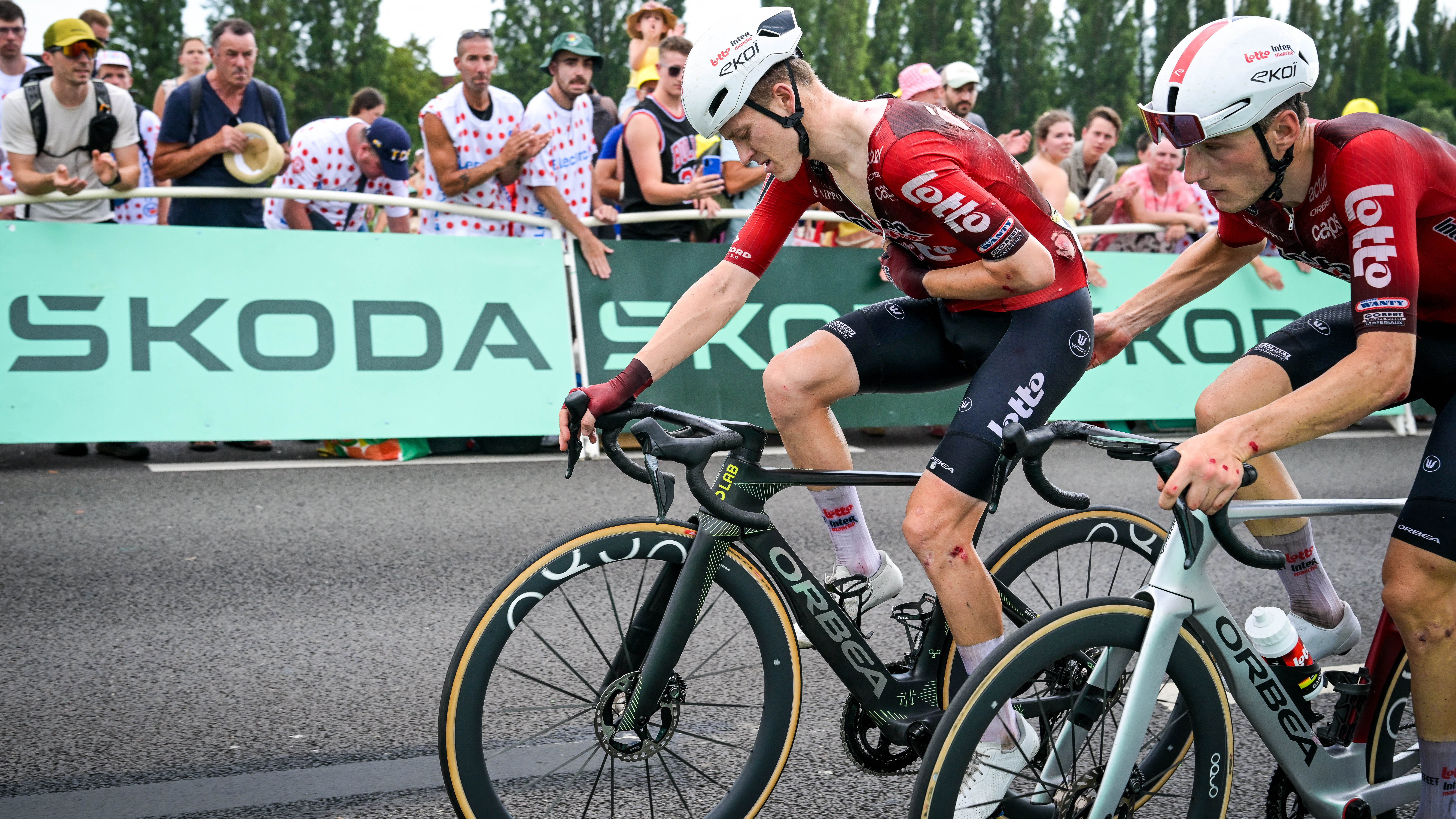 Jenno Berckmoes of Lotto Intermarche is injured after a crash on stage 12 of the 2026 Tour de France