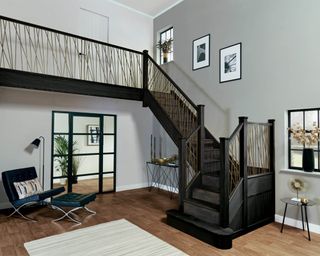 Black and bronze staircase railing idea by Neville Johnson